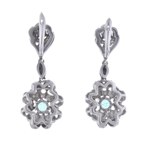Emeralds and diamonds floral earrings.