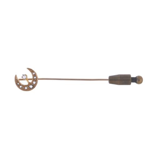 Moon-shaped tie pin.