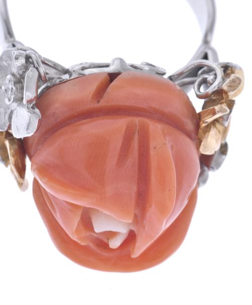 Ring with rose coral flower and diamonds.