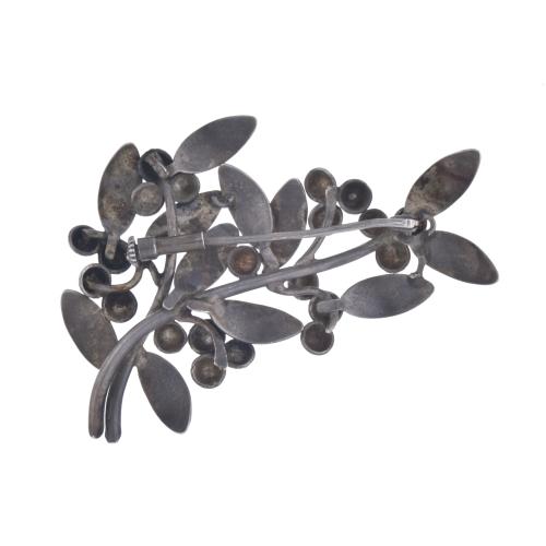 Modernist brooch with floral motifs.