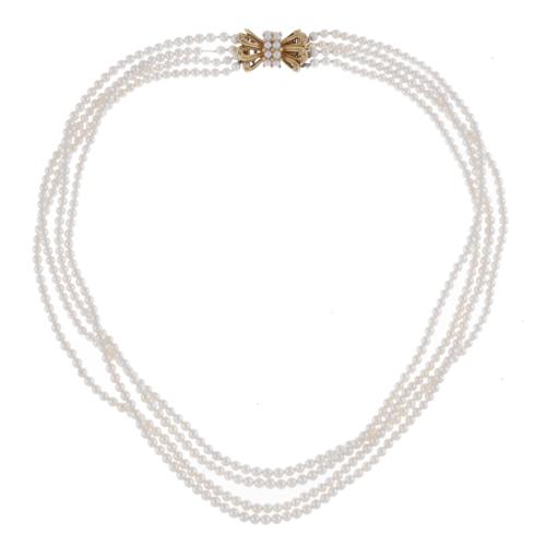 Four-strand pearls necklace.