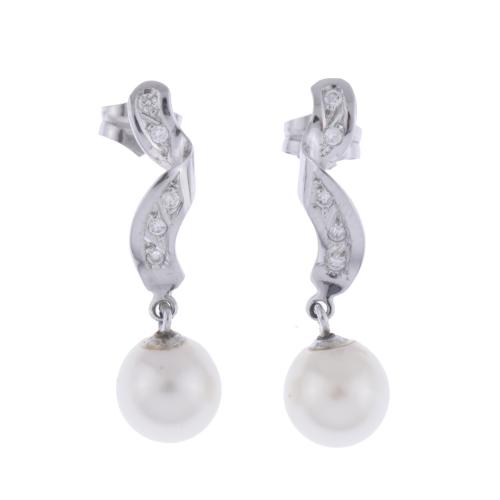 Long earrings with a spiral of diamonds and pearls.
