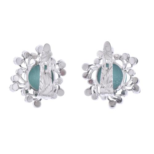 Floral earrings with turquoises and diamonds.