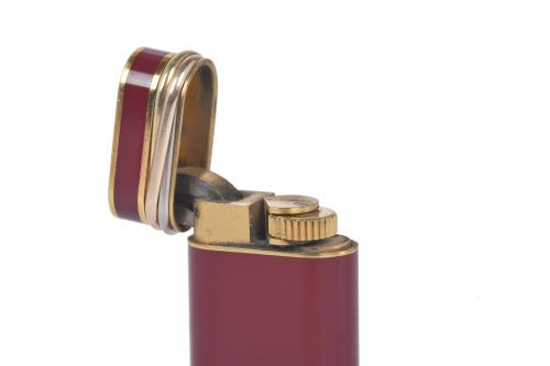 CARTIER. Encendedor modelo "Trinity". 