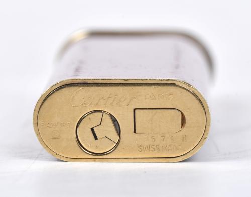CARTIER. Encendedor modelo "Trinity". 