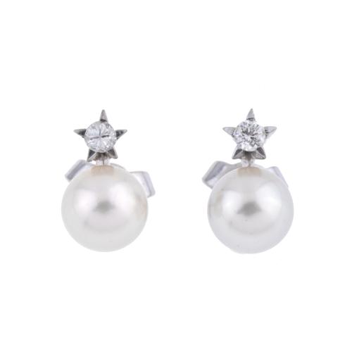 Pendientes tu y yo con perlas y diamantes.