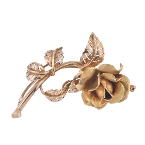 Rose-shaped brooch.