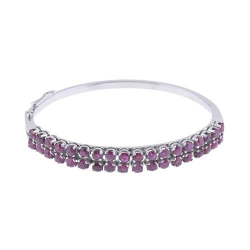 Brazalete semi - rígido con rubíes.