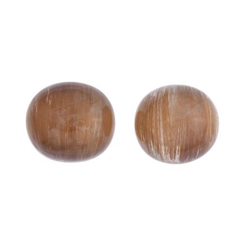 Pair of unmounted golden rutilated quartzes.