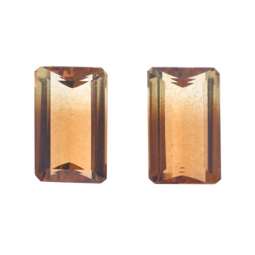 Pair of unmounted two-coloured citrines.