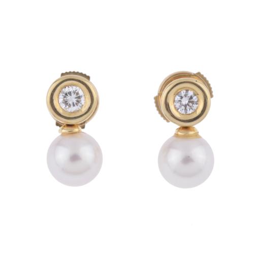 Pendientes tu y yo con diamante y perla.