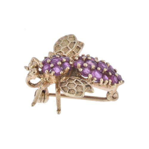 Bee-shaped brooch.