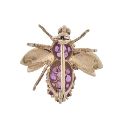 Bee-shaped brooch.