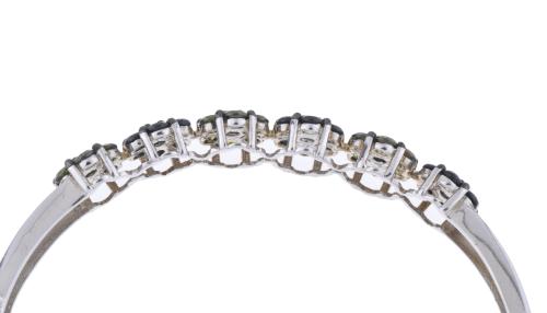 Semi-rigid floral bracelet with olivines and zircons.
