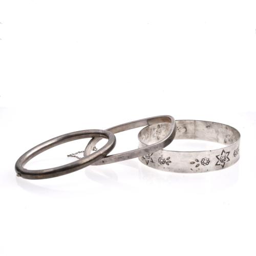 Set of three silver bracelets.