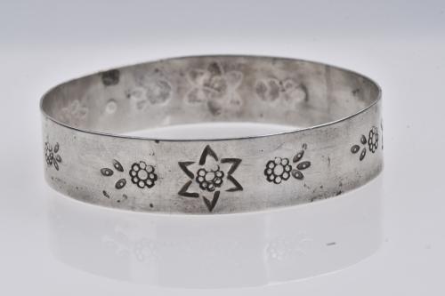 Set of three silver bracelets.