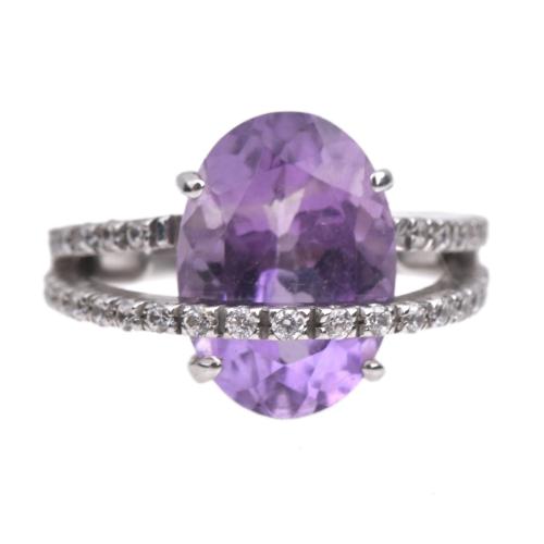 Ring with amethyst and double row of diamonds.
