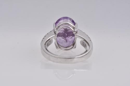 Ring with amethyst and double row of diamonds.