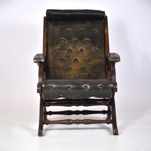 VALENTÍ. Leather armchair with ottoman, mid 20th century.