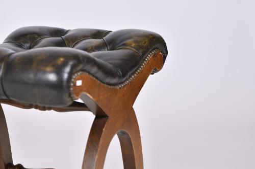 VALENTÍ. Leather armchair with ottoman, mid 20th century.