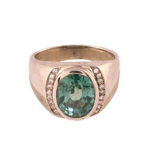 Anillo con símil de turmalina y circonitas.