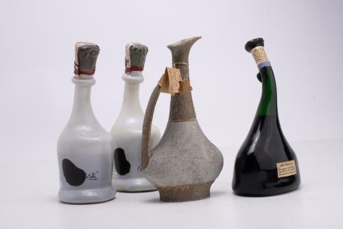 Set of four cognac bottles.