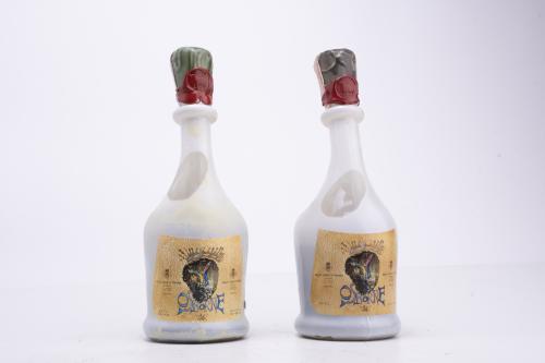 Set of four cognac bottles.