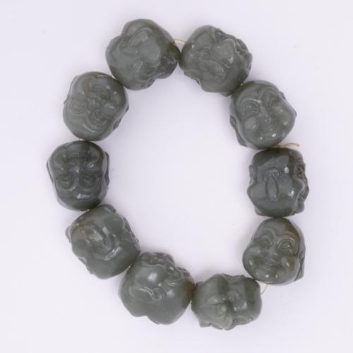 20TH CENTURY CHINESE SCHOOL. Bracelet with Buddha heads.