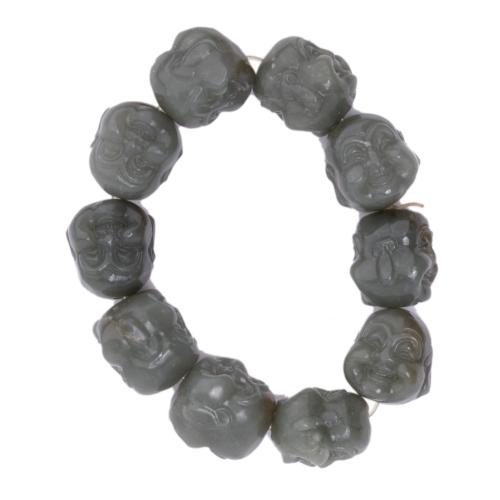 20TH CENTURY CHINESE SCHOOL. Bracelet with Buddha heads.