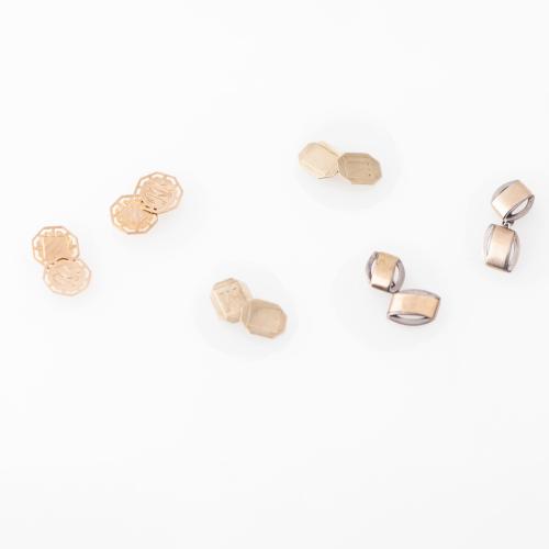 Three pairs of cufflinks.