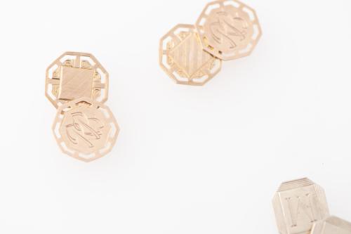 Three pairs of cufflinks.