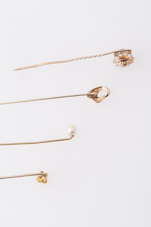 Set of four tie pins