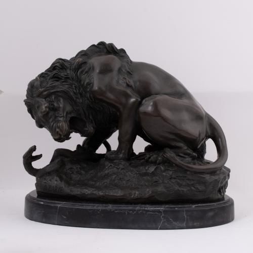 AFTER MODELS BY ANTOINE LOUIS BARYE (1796–1875). “Lion posant la patte sur un serpent”.