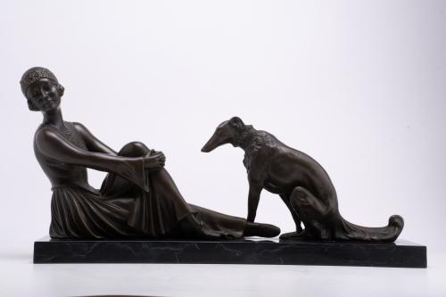AFTER MODELS BYT DEMETRE CHIPARUS (1886-1947).  ‘Lady with Afghan Hound’.