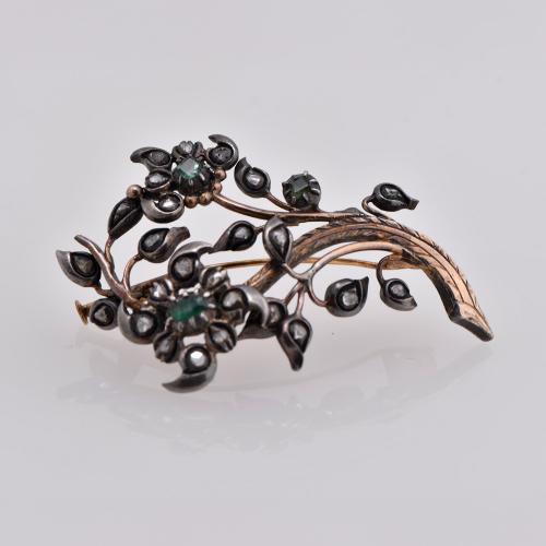 Diamonds and emeralds floral brooch, early 20th century.