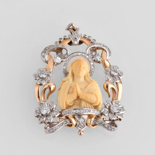 1930's pendant with an image of Madonna and floral motifs.