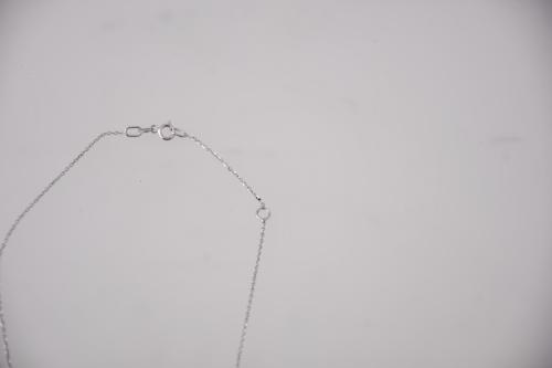 Rhombus-shaped pendant necklace with diamonds.