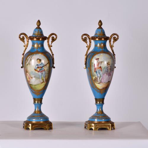 AFTER SEVRES MODELS, pair of urns, 20th century.