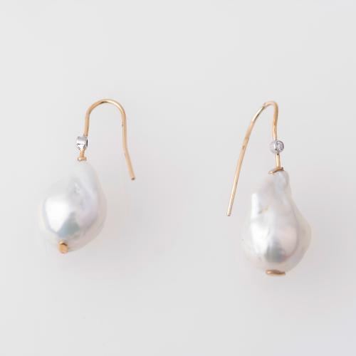 Earrings with Baroque pearls.