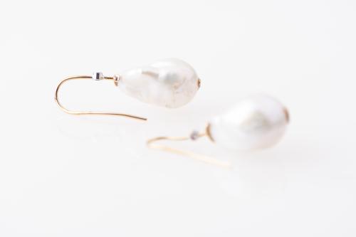 Earrings with Baroque pearls.