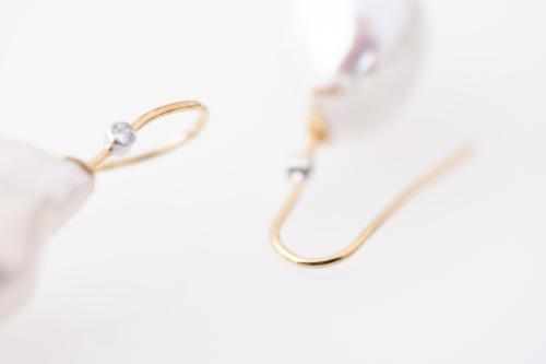 Earrings with Baroque pearls.
