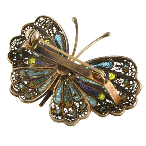 Butterfly-shaped enamel brooch.