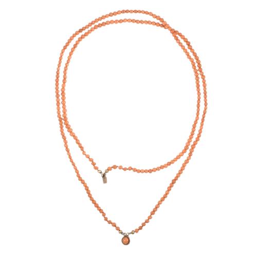 Necklace and earrings set with coral beads.