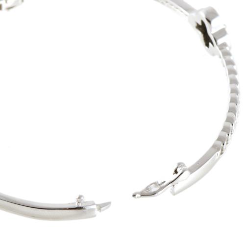 Pulsera de media caña con detalle en forma de trébol en óni