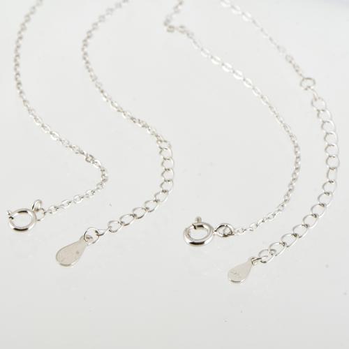 Set of two necklaces with zircons pendants.