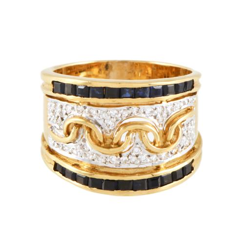 Anillo ancho con zafiros y diamantes.