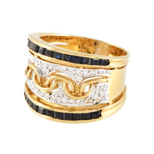 Anillo ancho con zafiros y diamantes.