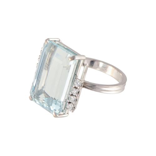 Ring with large aquamarine and diamonds.
