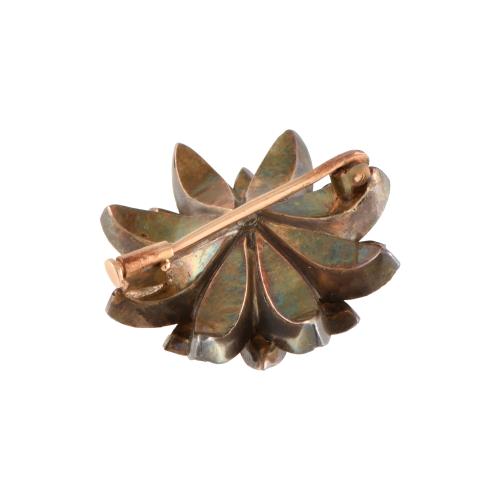 Empire flower-shaped brooch with diamonds.