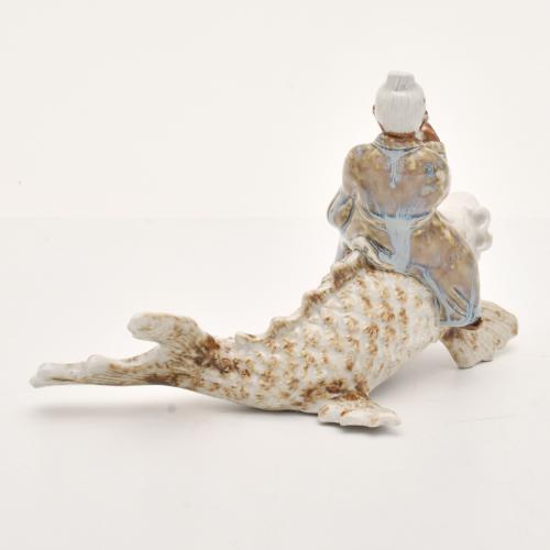 AFTER CHINESE MODELS, Figure of an old man on a Koi, 20th c